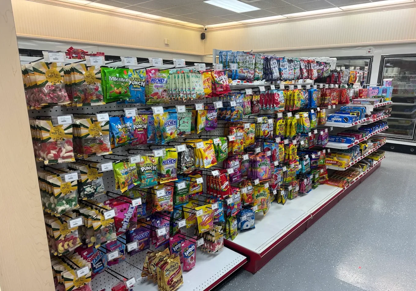 Chips and candy aisle inside Eagle Smoke & Convenience Shop