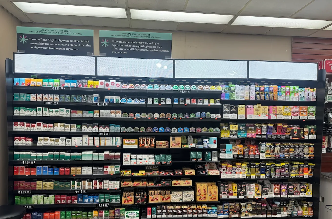 Cigarette and tobacco display wall inside Eagle Smoke & Convenience Shop