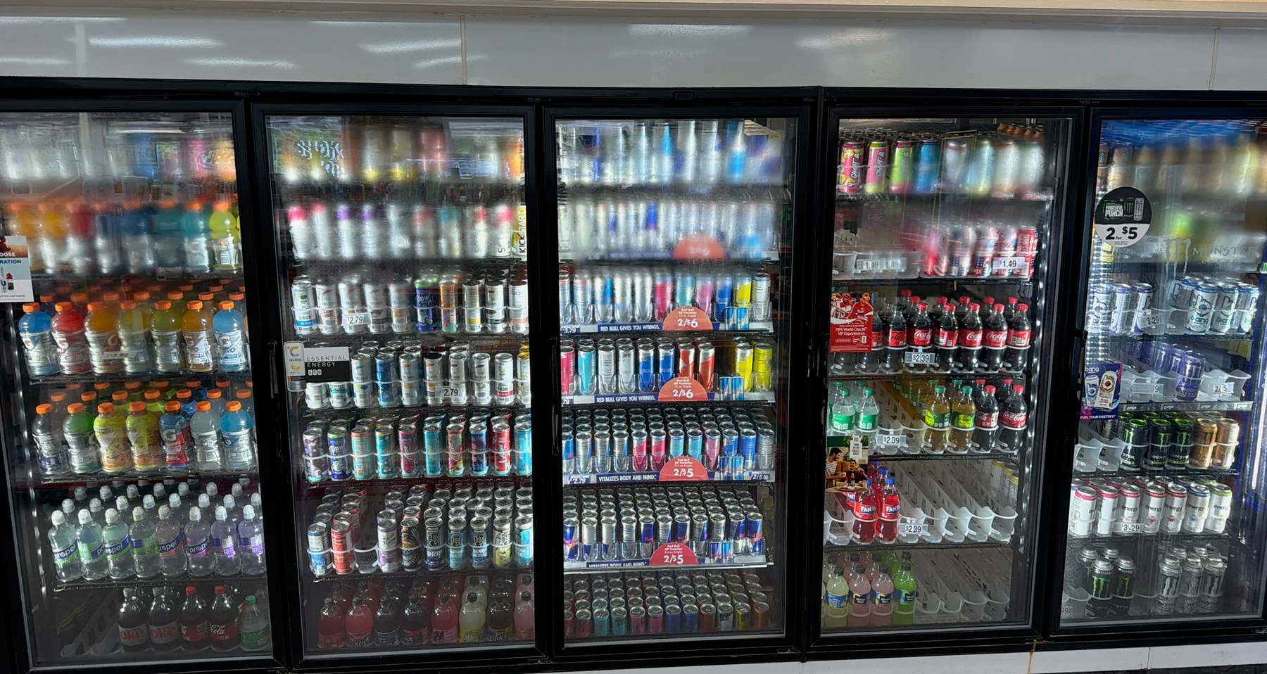 Refrigerated drinks inside Eagle Smoke & Convenience Shop
