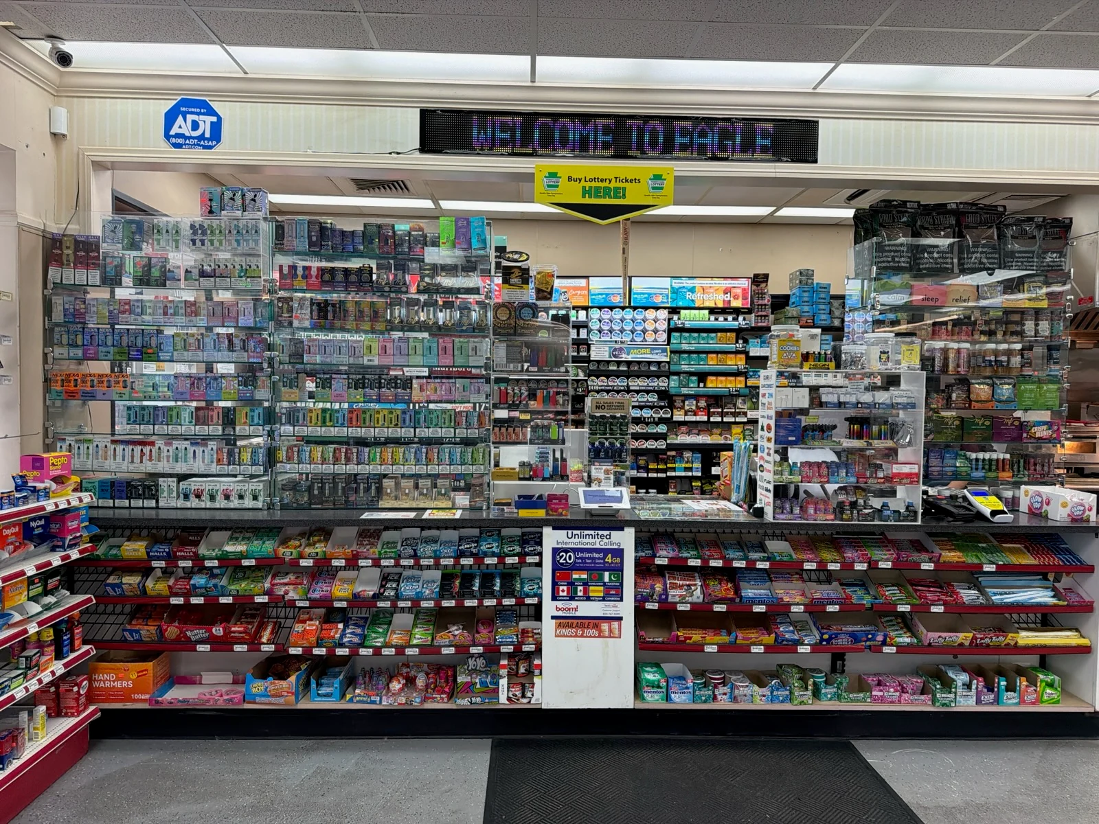 Store counter and product displays inside Eagle Smoke & Convenience Shop